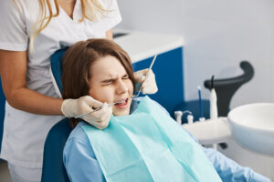 A child undergoes painful dental treatment.