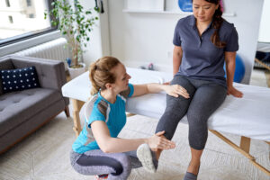A woman receiving physiotherapy after a negligent hip replacement surgery