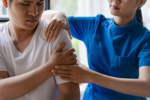 A man receives physiotherapy treatment