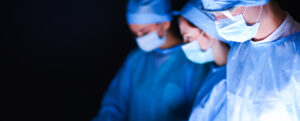 A team of surgeons in an operating theatre