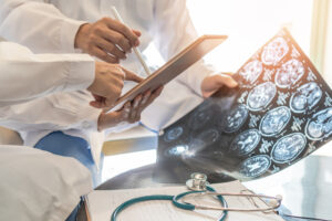 Medical professional looking at x-rays