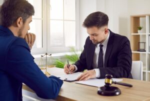 A solicitor explaining how pneumonia misdiagnosis claims work to their client.