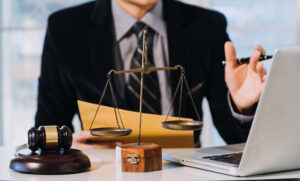 Solicitor holding pen working on ectopic pregnancy medical negligence case.